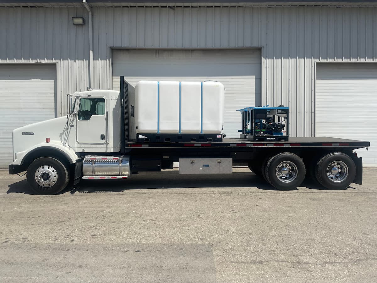 Flatbed truck with a water tank